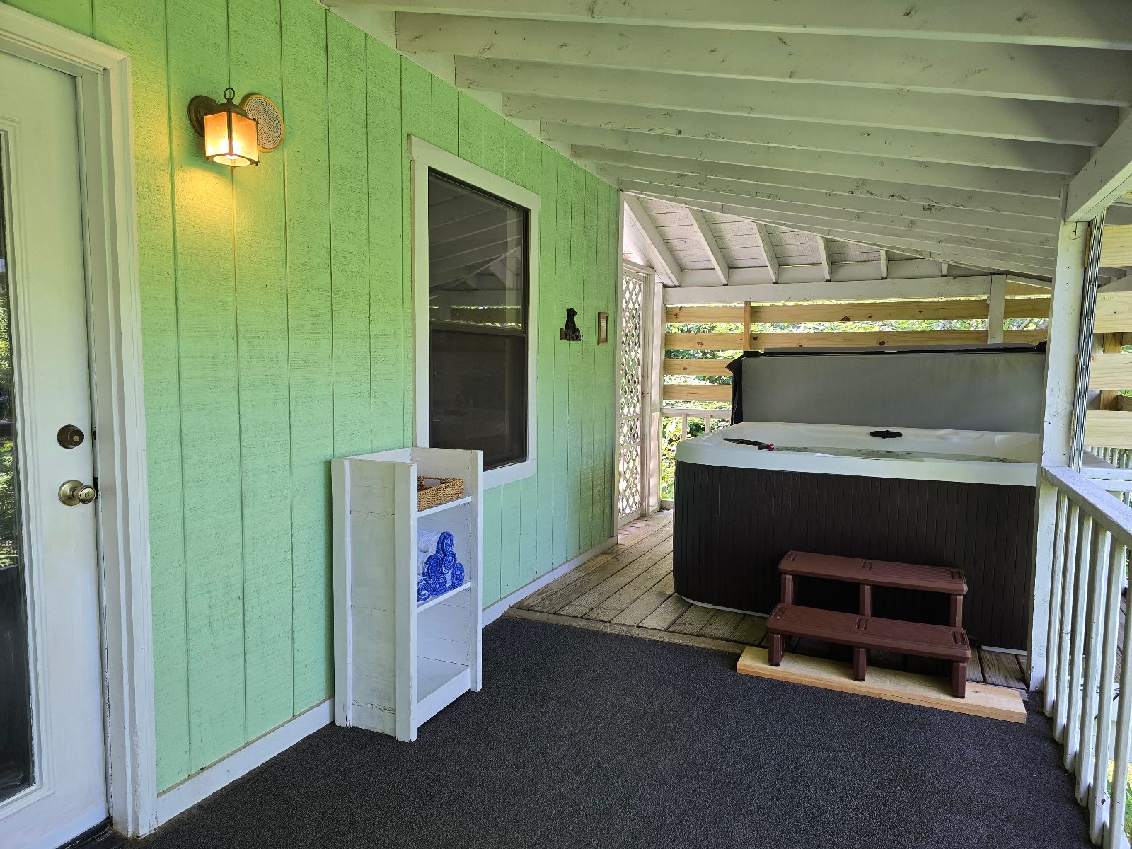Six-person hot tub on the covered back porch
